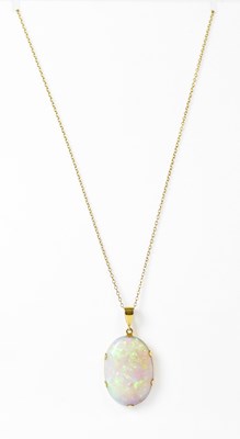 Lot 852 - A 9ct gold pendant claw set with an oval...