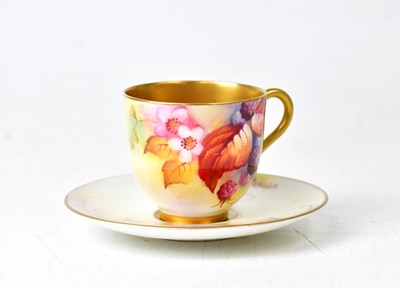 Lot 134 - ROYAL WORCESTER; a cup and saucer by Kitty...