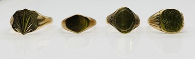 Lot 1052 - Four 9ct gold signet rings, combined approx 14....