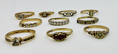 Lot 1065 - Ten 9ct gold dress rings, combined approx 15g.