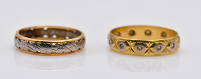 Lot 1070 - An 18ct gold two stone wedding band and an...