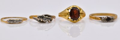 Lot 1073 - Four 18ct gold dress rings, combined approx 9.6g.