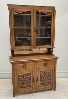 Lot 113 - An Arts & Crafts oak bookcase the upper...