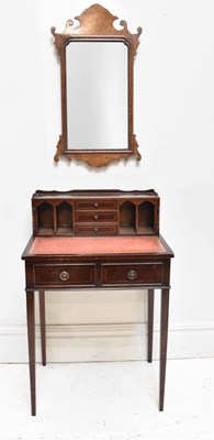 Lot 73 - A reproduction six drawer writing table,...