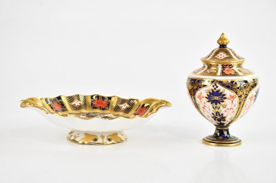 Lot 1750 - ROYAL CROWN DERBY; an Imari footed twin...