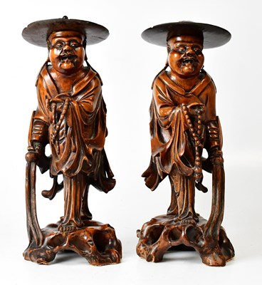 Lot 181 - A pair of Japanese carved wooden figures of...