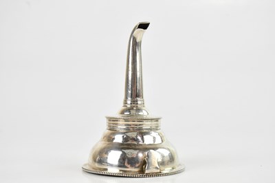 Lot 552 - A white metal white funnel, length 11cm.