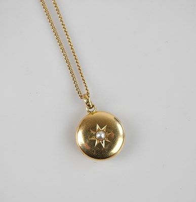 Lot 2162 - A yellow metal circular locket, set with...