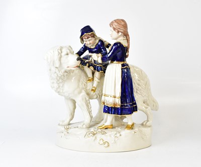 Lot 123 - ROYAL DUX; a porcelain figure group of a child...