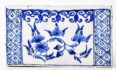 Lot 247 - A late 18th/early 19th century Delftware brick...