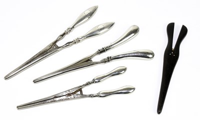 Lot 2360 - Three pairs of hallmarked silver handled glove...