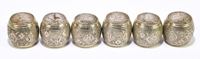 Lot 2304 - A set of six white metal Persian style napkin...