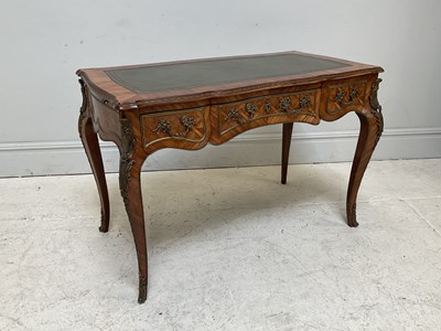 Lot 87 - A French kingwood bureau plat, with green...