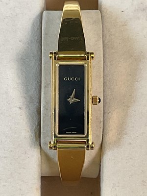 Lot 1128 - GUCCI; a boxed lady's gilded stainless steel...