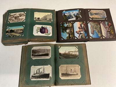 Lot 2113 - Three postcard albums containing approximately...