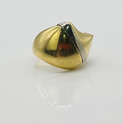 Lot 729 - An 18ct yellow gold domed ring with white gold...