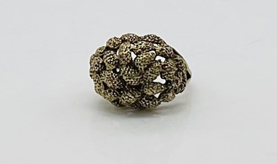 Lot 743 - A 9ct yellow gold textured openwork domed ring,...