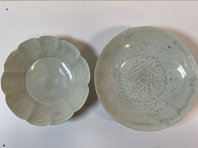 Lot 14 - A Chinese Qianlong pale celadon glazed footed...