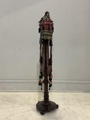 Lot 1525 - A Turkmen bridal headdress on mahogany stand,...