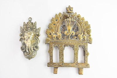 Lot 1540 - A brass wall hanging bust of Ganesh, 17cm,...