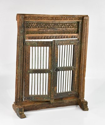 Lot 1546 - An Indian carved window framed and shutters,...