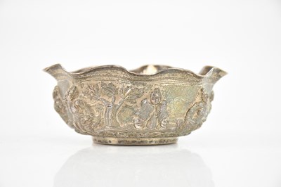 Lot 1715 - An Eastern white metal bowl decorated with...