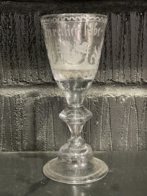 Lot 460 - An 18th century German wine glass with folded...