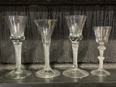 Lot 437 - Four clear air twist stem glasses, including...