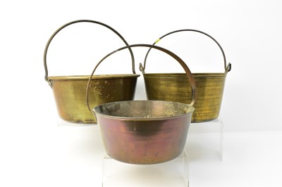 Lot 884 - Three brass jam pans of various sizes, all...