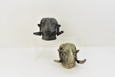 Lot 882 - A pair of decorative cast metal rams' head...