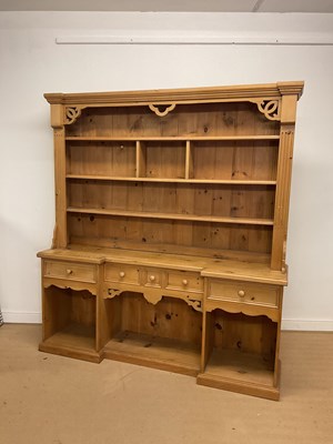 Lot 2795 - A large pine dresser with plate rack shelves,...
