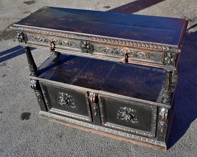Lot 1582 - A late 19th century carved oak buffet