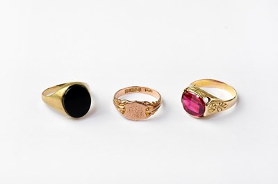 Lot 1036 - A 14ct gold ring set with red stones together...