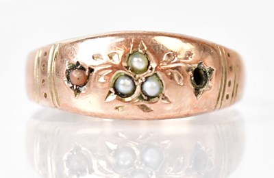Lot 1070 - A 9ct rose gold ring with floral engraved...