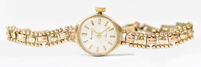 Lot 1153 - ACCURIST; a 9ct gold cocktail watch, the dial...