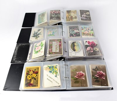 Lot 765 - Four postcard albums containing early/mid-20th...