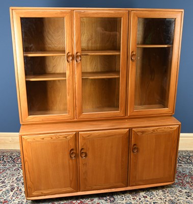 Lot 1420 - ERCOL; a light elm dresser, the back section...