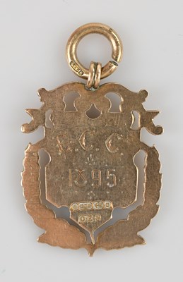 Lot 461 - A 9ct gold watch chain prize fob, awarded by...