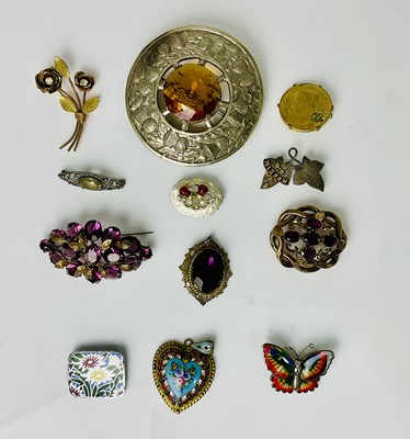 Lot 629 - A large Scottish base metal cloak pin, an...
