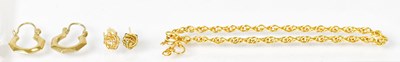 Lot 1111 - A pair of 9ct gold hoop earrings, a pair of...