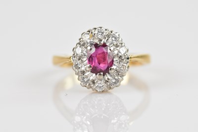 Lot 2337 - An 18ct yellow gold cluster ring, set with a...