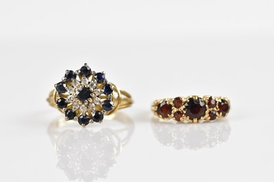 Lot 2455 - A 9ct yellow gold diamond and sapphire cluster...