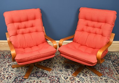 Lot 1430 - A pair of circa 1970s revolving easy chairs...