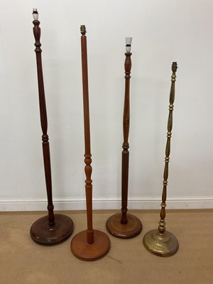 Lot 2724 - Four various floor lamps, comprising one brass,...