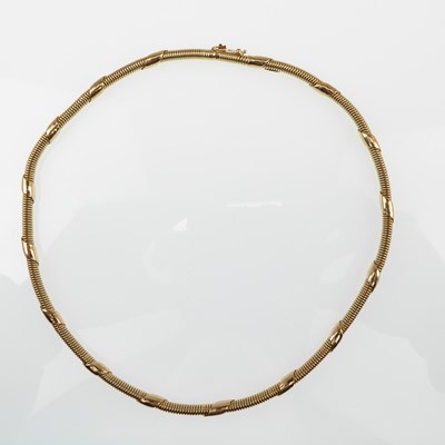 Lot 1154 - A 14ct gold contemporary necklace with spiral...