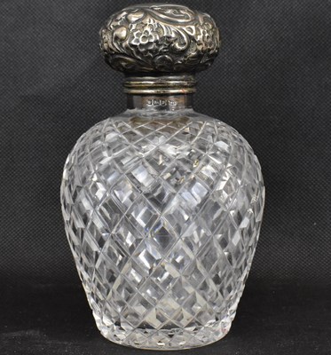 Lot 845 - An Edwardian cut glass cologne decanter with...