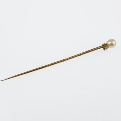 Lot 1143 - A gold pin with tiny claw set brilliant cut...