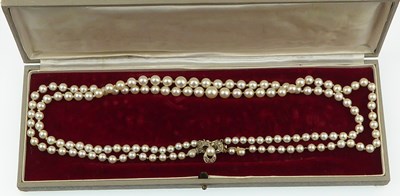 Lot 1187 - A two-strand cultured pearl necklace with...