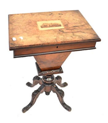Lot 6 - A Victorian walnut sewing table, the top with...