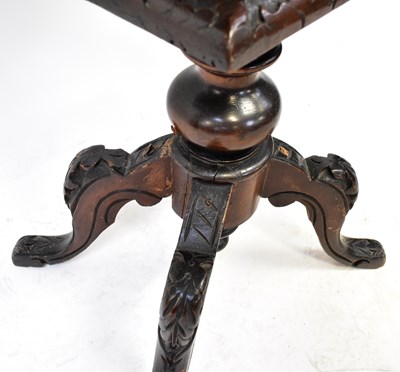 Lot 6 - A Victorian walnut sewing table, the top with...